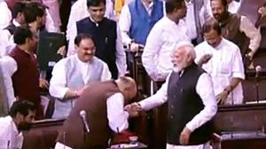 Prime Minister Narendra Modi greets Union Home Minister Amit Shah after the Jammu and Kashmir Reorganisation Bill being passed by Rajya Sabha in New Delhi on Monday. (ANI Photo) Prime Minister Narendra Modi greets Union Home Minister Amit Shah after the Jammu and Kashmir Reorganisation Bill being passed by Rajya Sabha in New Delhi on Monday. (ANI Photo)