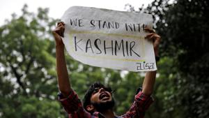 A man holds a sign and shouts slogans during a protest after the government scrapped the special status for Kashmir, in New Delhi, India, August 5, 2019.(REUTERS)