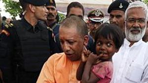 Uttar Pradesh, July 21 (ANI): Uttar Pradesh Chief Minister Yogi Adityanath along with Uttar Pradesh BJP State president Swatantra Dev Singh meets with the Umbha Village incident dead and injured victim's family in Village in Sonbhadra on Sunday. (ANI Photo) Uttar Pradesh, July 21 (ANI): Uttar Pradesh Chief Minister Yogi Adityanath along with Uttar Pradesh BJP State president Swatantra Dev Singh meets with the Umbha Village incident dead and injured victim's family in Village in Sonbhadra on Sunday. (ANI Photo)