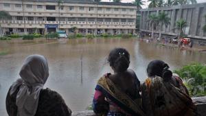 Local people look at a submerged residential in Sangli, India, on Thursday, August 8, 2019.(Photo by Uday Deolekar/ Hindustan Times) Local people look at a submerged residential in Sangli, India, on Thursday, August 8, 2019.(Photo by Uday Deolekar/ Hindustan Times)