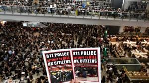 Pro-democracy protesters gather against the police brutality and the controversial extradition bill at Hong Kong's international airport on August 12, 2019.(AFP) Pro-democracy protesters gather against the police brutality and the controversial extradition bill at Hong Kong's international airport on August 12, 2019.(AFP)