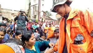 Some women in Maharashtra’s Kolhapur district were seen tying ‘rakhis’ on the wrist of NDRF personnel.(Twitter/@indiannavy) Some women in Maharashtra’s Kolhapur district were seen tying ‘rakhis’ on the wrist of NDRF personnel.(Twitter/@indiannavy)