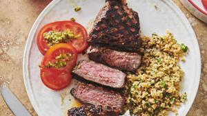 Grilled marinated New York Strip Steak in New York. Marinating is a terrific basic kitchen technique.(AP) Grilled marinated New York Strip Steak in New York. Marinating is a terrific basic kitchen technique.(AP)