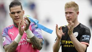 Manchester City's goalkeeper Ederson and Kevin De Bruyne, right, applaud at the end.(AP) Manchester City's goalkeeper Ederson and Kevin De Bruyne, right, applaud at the end.(AP)