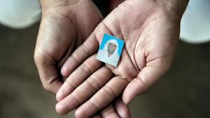 Irshad Khan, 24, holds a picture of his late father Pehlu, 55, in Jaisinghpur.(REUTERS) Irshad Khan, 24, holds a picture of his late father Pehlu, 55, in Jaisinghpur.(REUTERS)