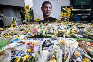 File photo of tributes left outside the stadium in memory of Emiliano Sala.(REUTERS) File photo of tributes left outside the stadium in memory of Emiliano Sala.(REUTERS)