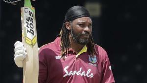 West Indies opener Chris Gayle raises his bat to the crowd after reaching a half century in third ODI against India.(AP) West Indies opener Chris Gayle raises his bat to the crowd after reaching a half century in third ODI against India.(AP)