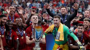 Jordan Henderson lifts the trophy as he celebrates winning the UEFA Super Cup with team mates.(Action Images via Reuters) Jordan Henderson lifts the trophy as he celebrates winning the UEFA Super Cup with team mates.(Action Images via Reuters)