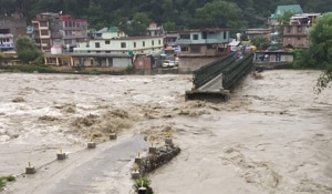 A portion of the bridge over Beas river in Kullu town washed away by the flooded river following heavy rain.(ANI Photo) A portion of the bridge over Beas river in Kullu town washed away by the flooded river following heavy rain.(ANI Photo)