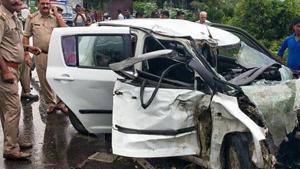 Police and people near the wreckage of the car in which the Unnao rape survivor was travelling during its collision with a truck near Raebareli on July 28, 2019.(PTI File Photo) Police and people near the wreckage of the car in which the Unnao rape survivor was travelling during its collision with a truck near Raebareli on July 28, 2019.(PTI File Photo)