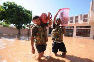 Army personnel carry household items of the residents of Motipur Khalsa village during a rescue operation, in Jalandhar, Punjab .(HT Photo) Army personnel carry household items of the residents of Motipur Khalsa village during a rescue operation, in Jalandhar, Punjab .(HT Photo)