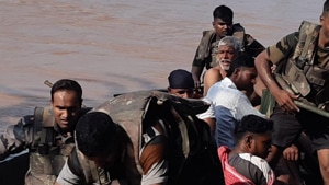 Teams of the NDRF and the army along with officials of the district administration rushed to the villages to rescue those stranded in the floodwater.(HT Photo) Teams of the NDRF and the army along with officials of the district administration rushed to the villages to rescue those stranded in the floodwater.(HT Photo)