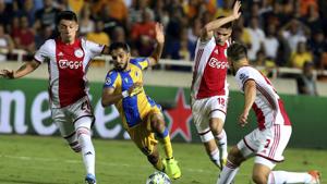 Ajax's Joel Veltman, right, Razvan Marin, second right, and Lisandro Martinez, left, challenge APOEL's Musa Suleiman, second left, during the Champions League qualifying playoff first leg soccer match at GSP stadium in Nicosia, Cyprus, Tuesday, Aug. 20, 2019.(AP) Ajax's Joel Veltman, right, Razvan Marin, second right, and Lisandro Martinez, left, challenge APOEL's Musa Suleiman, second left, during the Champions League qualifying playoff first leg soccer match at GSP stadium in Nicosia, Cyprus, Tuesday, Aug. 20, 2019.(AP)