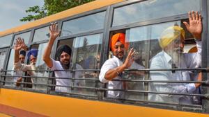 Sikh devotees wave as they leave in a bus for Pakistan via Attari-Wagah border, to take part in a religious procession to celebrate the 550th birth anniversary of Guru Nanak Dev Ji at Gurdwara Nankana Sahib, in Amritsar, July 30, 2019.(PTI File)