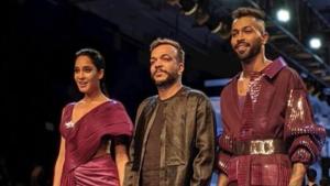 Cricketer Hardik Pandya with designer Amit Aggarwal and actor Lisa Haydon during the Lakme Fashion Week 2019.(Twitter) Cricketer Hardik Pandya with designer Amit Aggarwal and actor Lisa Haydon during the Lakme Fashion Week 2019.(Twitter)