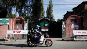 A man rides a motorcycle passing a closed college during restrictions, after the scrapping of the special constitutional status for Kashmir by the Indian government, in Srinagar. The elections for the municipal corporations were held in four phases in October last year after a gap of 13 years.(REUTERS) A man rides a motorcycle passing a closed college during restrictions, after the scrapping of the special constitutional status for Kashmir by the Indian government, in Srinagar. The elections for the municipal corporations were held in four phases in October last year after a gap of 13 years.(REUTERS)