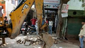 At least 15 old cars and two-wheelers illegally parked along the road were impounded. There were multiple shops along the road which, over the years, had built extensions on the footpath, some of which even touched the road.(SOURCED) At least 15 old cars and two-wheelers illegally parked along the road were impounded. There were multiple shops along the road which, over the years, had built extensions on the footpath, some of which even touched the road.(SOURCED)
