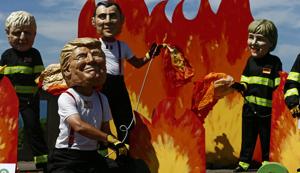 A man wearing a mask President Donald Trump, front left, is joined by other 'world leaders' during a protest ahead of the G-7 summit in Biarritz, France Friday, Aug. 23, 2019.(AP photo) A man wearing a mask President Donald Trump, front left, is joined by other 'world leaders' during a protest ahead of the G-7 summit in Biarritz, France Friday, Aug. 23, 2019.(AP photo)