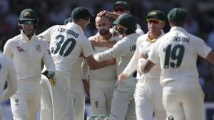 Australian players congratulate Nathan Lyon, centre, after dismissing England's captain Joe Root.(AP) Australian players congratulate Nathan Lyon, centre, after dismissing England's captain Joe Root.(AP)