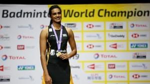 India's Pusarla Sindhu celebrates on the podium with her gold medal after winning the women's singles final in the BWF World Championships in Basel.(REUTERS) India's Pusarla Sindhu celebrates on the podium with her gold medal after winning the women's singles final in the BWF World Championships in Basel.(REUTERS)