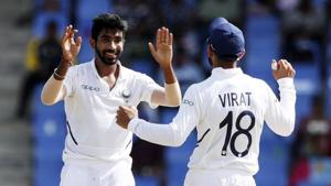 India's Jasprit Bumrah celebrates with team captain Virat Kohli the dismissal of West Indies' Darren Bravo during day two of the first Test cricket match at the Sir Vivian Richards cricket ground in North Sound, Antigua and Barbuda.(AP) India's Jasprit Bumrah celebrates with team captain Virat Kohli the dismissal of West Indies' Darren Bravo during day two of the first Test cricket match at the Sir Vivian Richards cricket ground in North Sound, Antigua and Barbuda.(AP)
