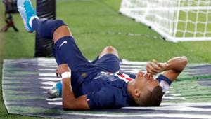 Paris St Germain's Kylian Mbappe reacts after sustaining an injury(REUTERS) Paris St Germain's Kylian Mbappe reacts after sustaining an injury(REUTERS)