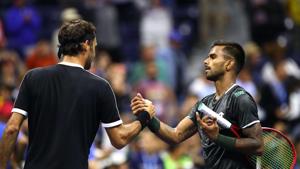 Roger Federer of Switzerland shakes hands with Sumit Nagal of India after their Men's Singles first round match on day one of the 2019 US Open.(AFP) Roger Federer of Switzerland shakes hands with Sumit Nagal of India after their Men's Singles first round match on day one of the 2019 US Open.(AFP)