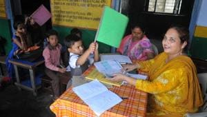 A student using a hand fan to get respite from heat at a primary school functioning without electricity for the last 20 years, in Kandhari Bazar in Lucknow.(HT/Deepak Gupta) A student using a hand fan to get respite from heat at a primary school functioning without electricity for the last 20 years, in Kandhari Bazar in Lucknow.(HT/Deepak Gupta)