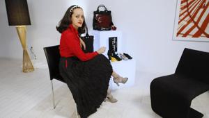 FILE - This Aug. 25, 2010 file photo shows designer Isabel Toledo posing with her shoes and handbags designed for Payless ShoeSource in Miami Beach, Fla.(AP Photo/Lynne Sladky, File) FILE - This Aug. 25, 2010 file photo shows designer Isabel Toledo posing with her shoes and handbags designed for Payless ShoeSource in Miami Beach, Fla.(AP Photo/Lynne Sladky, File)