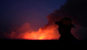 A man is seen on a burning tract of the Amazon jungle in Canarana, Mato Grosso state, Brazil August 26, 2019.(Reuters Photo) A man is seen on a burning tract of the Amazon jungle in Canarana, Mato Grosso state, Brazil August 26, 2019.(Reuters Photo)
