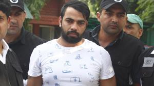 The Special Task Force (STF) Haryana police with gangster Kaushal who was arrested from Indira Gandhi International Airport early morning, at Police Commissioner Office, in Faridabad, Haryana, India, on Monday, August 26, 2019.(Yogendra Kumar/HT PHOTO) The Special Task Force (STF) Haryana police with gangster Kaushal who was arrested from Indira Gandhi International Airport early morning, at Police Commissioner Office, in Faridabad, Haryana, India, on Monday, August 26, 2019.(Yogendra Kumar/HT PHOTO)