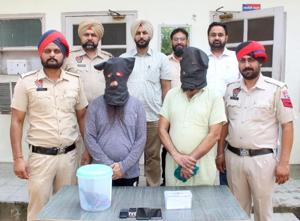 The accused (faces covered) in police custody(HT Photo)