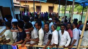 People wait in queue to check their names on the draft list at the National Register of Citizens (NRC) centre at a village in Nagaon district, Assam state, India.(REUTERS) People wait in queue to check their names on the draft list at the National Register of Citizens (NRC) centre at a village in Nagaon district, Assam state, India.(REUTERS)