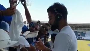 Virat Kohli signs autographs for fans at Sabina Park.(BCCI/ Twitter) Virat Kohli signs autographs for fans at Sabina Park.(BCCI/ Twitter)