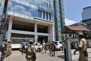 Security personnel stand guard outside an NRC centre before the final draft publication in Guwahati.(PTI)