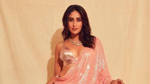Looks like the cocktail wear has got an au courant twist with statement tops with plunging necklines making the fluttery essential impossibly chic. Here’s the updated version of the classic six-yards seen on actors at soirees of late.(Instagram/ Kareena Kapoor Khan) Looks like the cocktail wear has got an au courant twist with statement tops with plunging necklines making the fluttery essential impossibly chic. Here’s the updated version of the classic six-yards seen on actors at soirees of late.(Instagram/ Kareena Kapoor Khan)