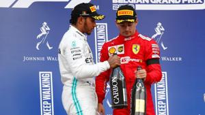 Ferrari's Charles Leclerc celebrates on the podium after winning the race with second placed Mercedes' Lewis Hamilton.(REUTERS) Ferrari's Charles Leclerc celebrates on the podium after winning the race with second placed Mercedes' Lewis Hamilton.(REUTERS)