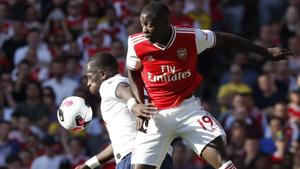 Arsenal's Nicolas Pepe, right, fights for the ball with Tottenham's Moussa Sissoko.(AP) Arsenal's Nicolas Pepe, right, fights for the ball with Tottenham's Moussa Sissoko.(AP)