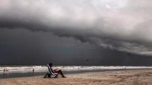 Tricia Cheshire, a resident of Amelia Island sunbathes for the last few minutes before storms hit the coast before Hurricane Dorian in Jacksonville, Florida.(Photo: Reuters) Tricia Cheshire, a resident of Amelia Island sunbathes for the last few minutes before storms hit the coast before Hurricane Dorian in Jacksonville, Florida.(Photo: Reuters)