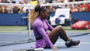 Serena Williams, of the United States, grabs her ankle after falling while chasing a return against Petra Martic, of Croatia(AP) Serena Williams, of the United States, grabs her ankle after falling while chasing a return against Petra Martic, of Croatia(AP)