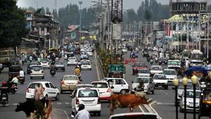 Vehicles ply after restrictions were eased in Srinagar on Saturday.(ANI photo) Vehicles ply after restrictions were eased in Srinagar on Saturday.(ANI photo)
