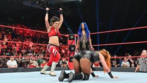 Bayley hits Becky Lynch with a steel chair as Sasha Banks watches on.(WWE) Bayley hits Becky Lynch with a steel chair as Sasha Banks watches on.(WWE)