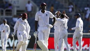 West Indies' captain Jason Holder looks up as players of India celebrate the dismissal of Shimron Hetmyer(AP) West Indies' captain Jason Holder looks up as players of India celebrate the dismissal of Shimron Hetmyer(AP)