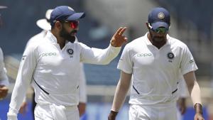 India's captain Virat Kohli, left, talks to Jasprit Bumrah(AP) India's captain Virat Kohli, left, talks to Jasprit Bumrah(AP)