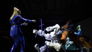Dancer and choreographer Silke Grabinger performs with a robot during her performance at the Ars Electronica on September 06, 2019 in Linz, Upper Austria. - Can artificial intelligence (AI) turn out symphonies to match one of the greats of classical music? That was the question posed by one unusual orchestra performance in the Austrian city of Linz in which Gustav Mahler's unfinished Symphony No.10 was played followed by six minutes of "Mahleresque" music written by software. (Photo by ALEX HALADA / AFP)(AFP) Dancer and choreographer Silke Grabinger performs with a robot during her performance at the Ars Electronica on September 06, 2019 in Linz, Upper Austria. - Can artificial intelligence (AI) turn out symphonies to match one of the greats of classical music? That was the question posed by one unusual orchestra performance in the Austrian city of Linz in which Gustav Mahler's unfinished Symphony No.10 was played followed by six minutes of "Mahleresque" music written by software. (Photo by ALEX HALADA / AFP)(AFP)