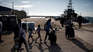 People get in a ferry at Marsh Harbour Government Port during an evacuation operation after Hurricane Dorian hit the Abaco Islands in Marsh Harbour, Bahamas.(Reuters photo) People get in a ferry at Marsh Harbour Government Port during an evacuation operation after Hurricane Dorian hit the Abaco Islands in Marsh Harbour, Bahamas.(Reuters photo)