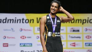 PV Sindhu poses on with the gold medal.(AFP) PV Sindhu poses on with the gold medal.(AFP)