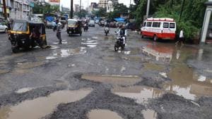 The Thane Municipal Corporation’s (TMC) promise of providing good roads for the 10-day Ganeshotsav festival has been washed down the drain with the heavy downpour this week. (Photo by Rishikesh Choudhary/ Hindustan Times) The Thane Municipal Corporation’s (TMC) promise of providing good roads for the 10-day Ganeshotsav festival has been washed down the drain with the heavy downpour this week. (Photo by Rishikesh Choudhary/ Hindustan Times)