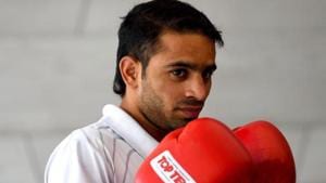 Indian boxer Amit Panghal poses for photographs wearing his gloves.(AFP) Indian boxer Amit Panghal poses for photographs wearing his gloves.(AFP)