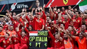 Ferrari's Charles Leclerc celebrates winning the race with team mates.(REUTERS) Ferrari's Charles Leclerc celebrates winning the race with team mates.(REUTERS)